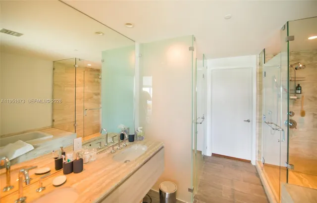 a bathroom with a bathtub and a shower