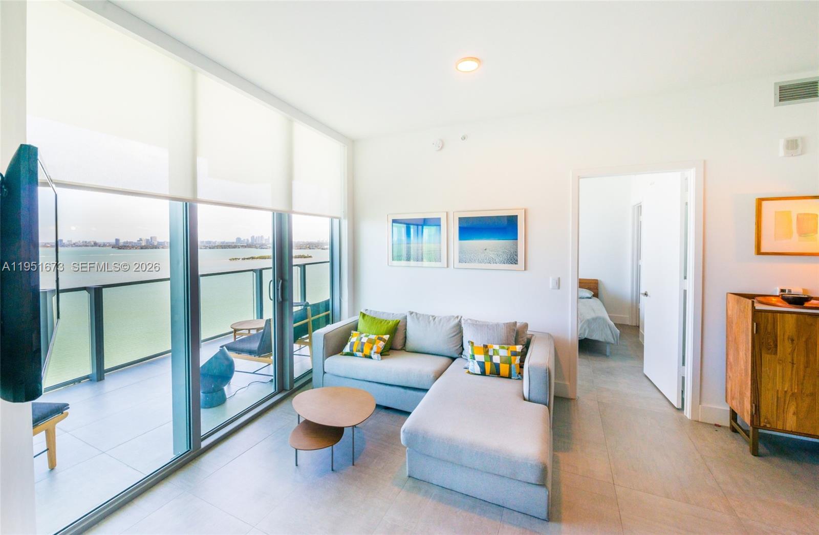 2900 Northeast 7th Avenue, Unit 1903 Miami, FL 33137 - Photo 6 of 43 a living room with furniture and a floor to ceiling window