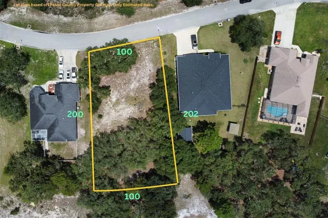 an aerial view of houses with outdoor space