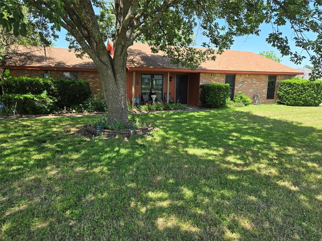 114 Anderson Road Red Oak, TX 75154 - Photo 1 of 1 View of front facade with a front yard, brick siding, and roof with shingles
