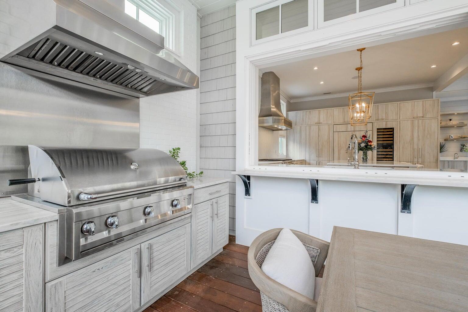 55 Seastone Ct Inlet Beach Inlet Beach, FL 32461 - Photo 16 of 68 a kitchen with stainless steel appliances granite countertop a stove and a sink