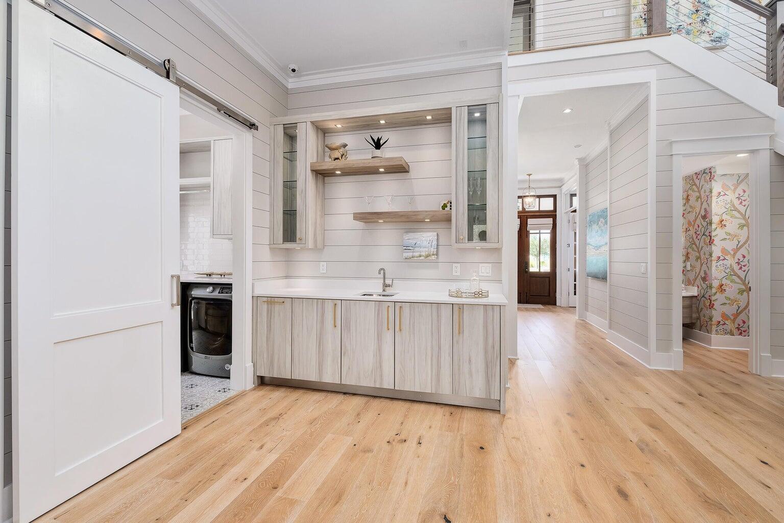 55 Seastone Ct Inlet Beach Inlet Beach, FL 32461 - Photo 18 of 68 a view of kitchen with stainless steel appliances cabinets and wooden floor