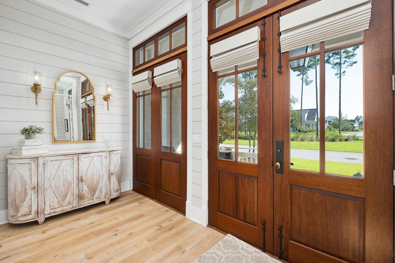 55 Seastone Ct Inlet Beach Inlet Beach, FL 32461 - Photo 22 of 68 a view of a entrance and room with wooden floor and windows