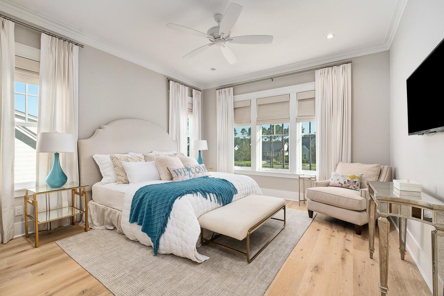 55 Seastone Ct Inlet Beach Inlet Beach, FL 32461 - Photo 37 of 68 a spacious bedroom with a bed couches and a flat tv screen