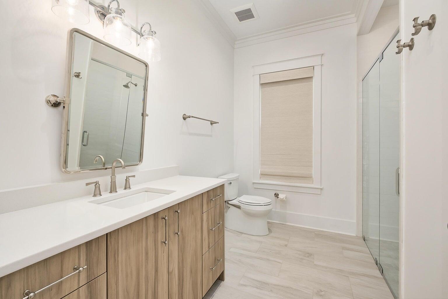 55 Seastone Ct Inlet Beach Inlet Beach, FL 32461 - Photo 40 of 68 a bathroom with a sink a toilet and shower