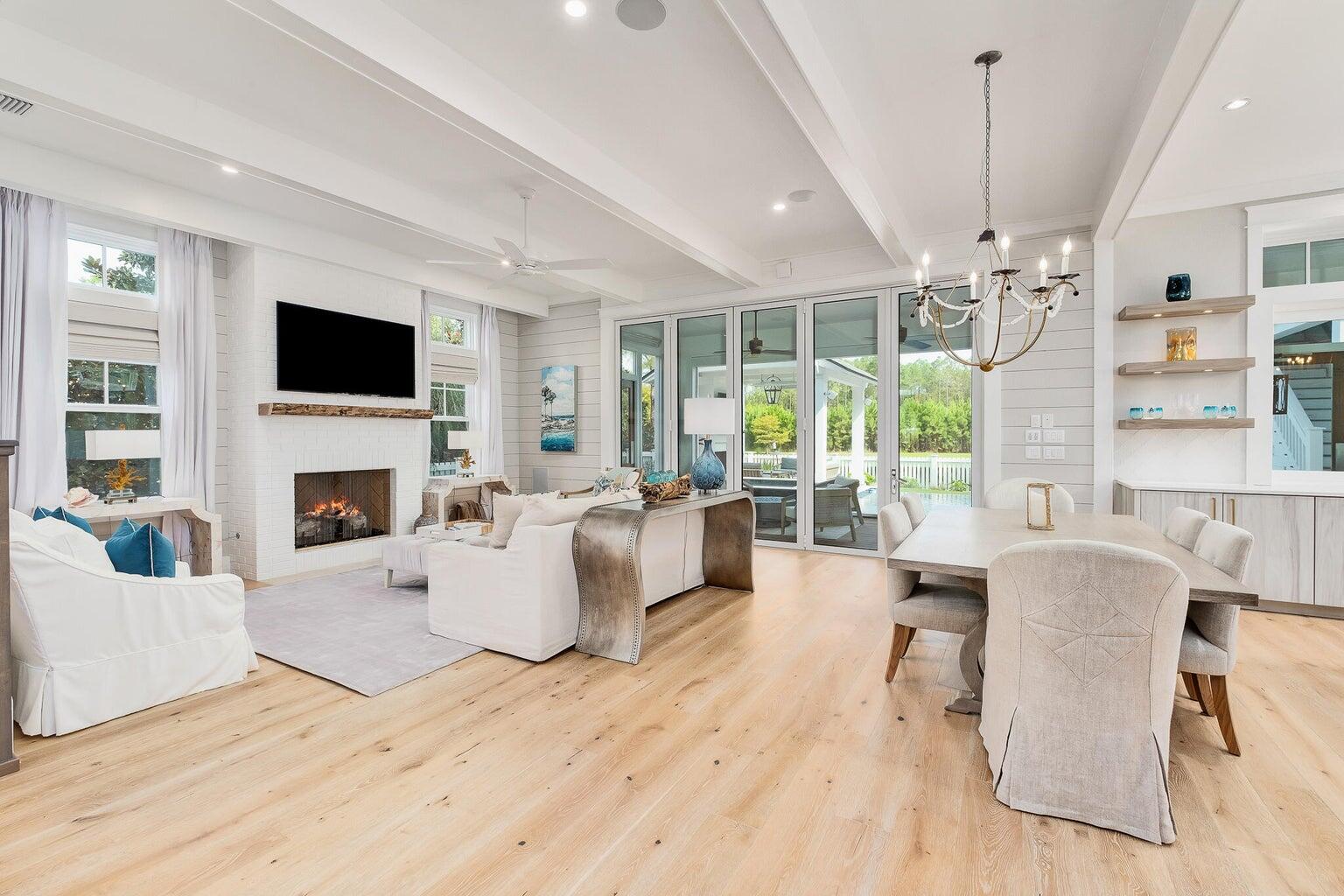 55 Seastone Ct Inlet Beach Inlet Beach, FL 32461 - Photo 4 of 68 a living room with fireplace furniture and a flat screen tv
