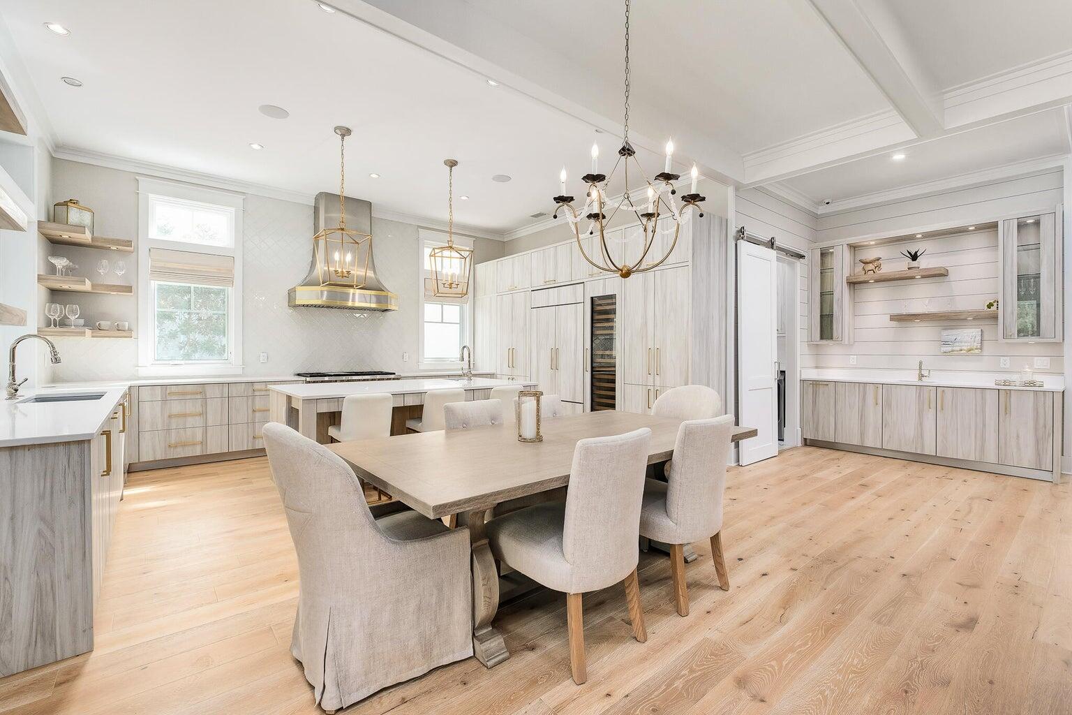 55 Seastone Ct Inlet Beach Inlet Beach, FL 32461 - Photo 5 of 68 a large kitchen with a table and chairs in it