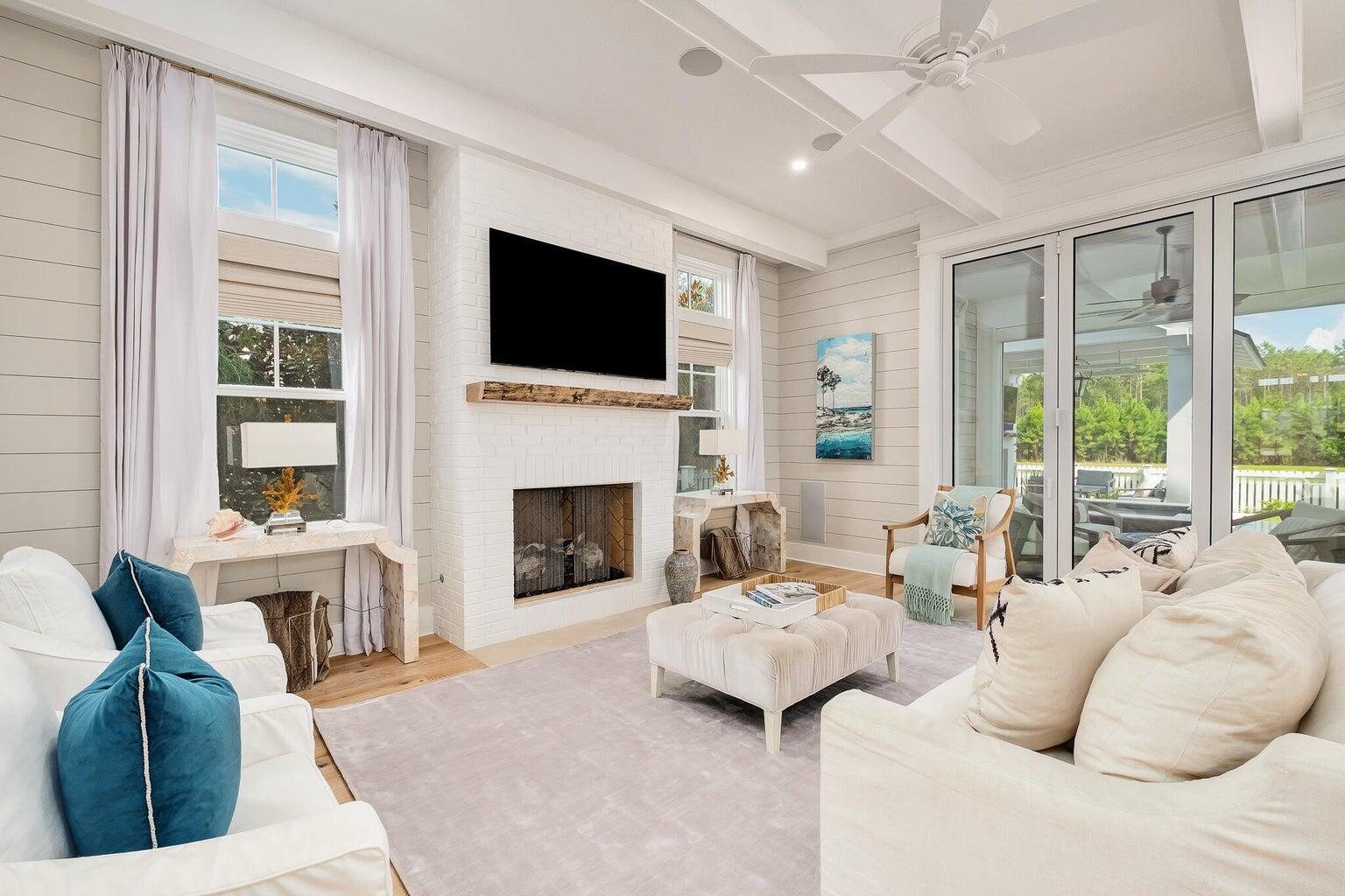 55 Seastone Ct Inlet Beach Inlet Beach, FL 32461 - Photo 7 of 68 a living room with furniture fireplace and a flat screen tv