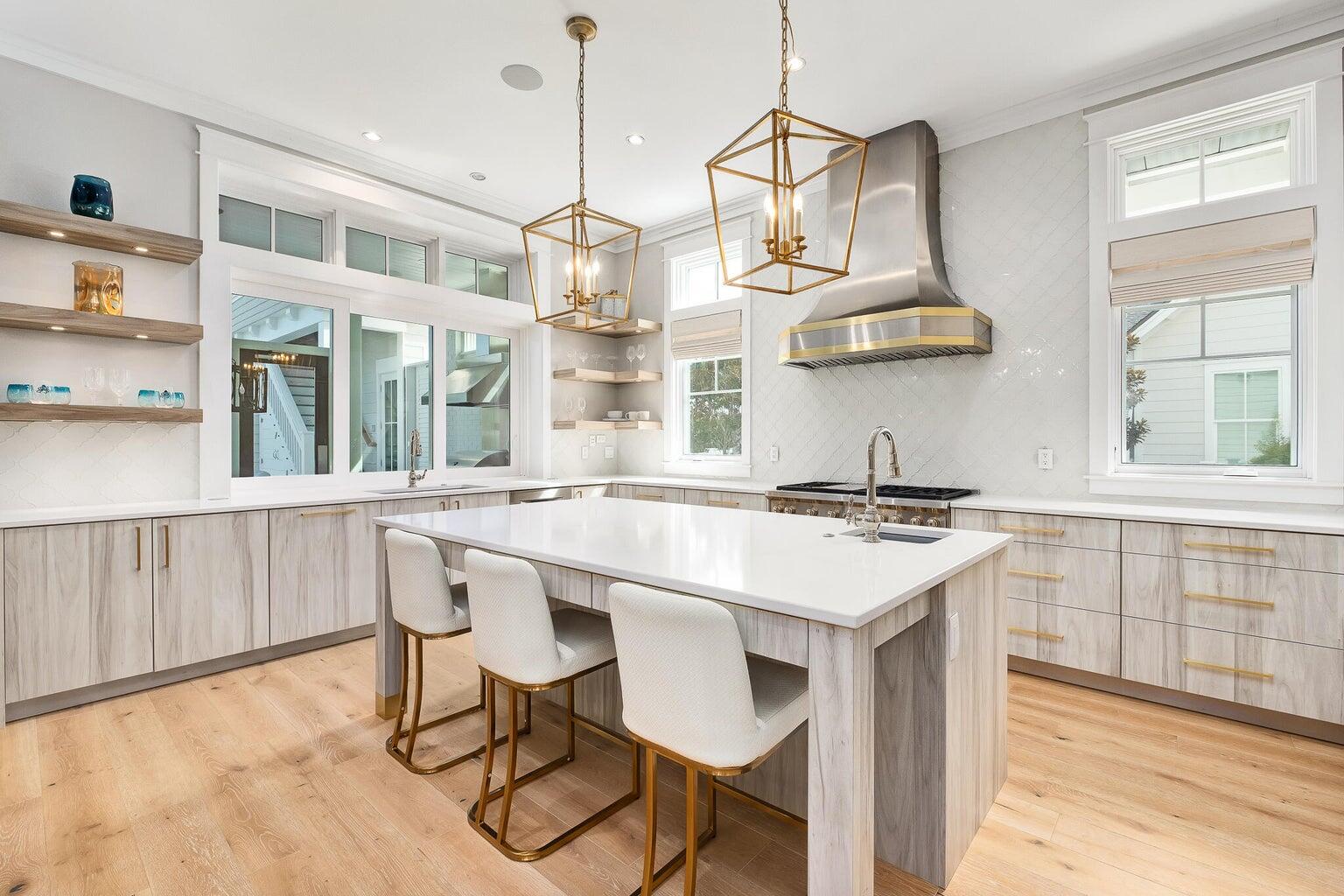 55 Seastone Ct Inlet Beach Inlet Beach, FL 32461 - Photo 8 of 68 a kitchen with stainless steel appliances a stove a table and chairs in it