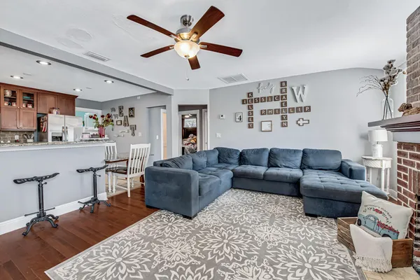 a living room with furniture and a fireplace