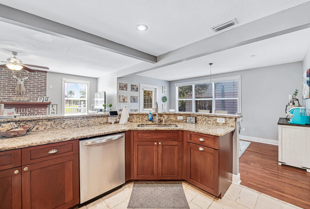 416 Deane Duff Street Clewiston, FL 33440 - Photo 8 of 45 a kitchen with a sink and cabinets