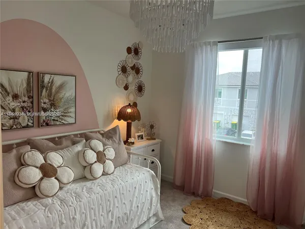 a bed room with a bed and a mirror