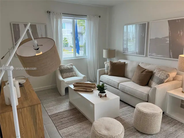 a living room with furniture and a window