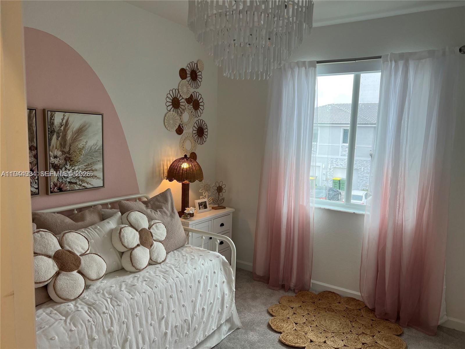 655 Southeast 13th Street Homestead, FL 33034 - Photo 22 of 38 a bedroom with a bed and a window