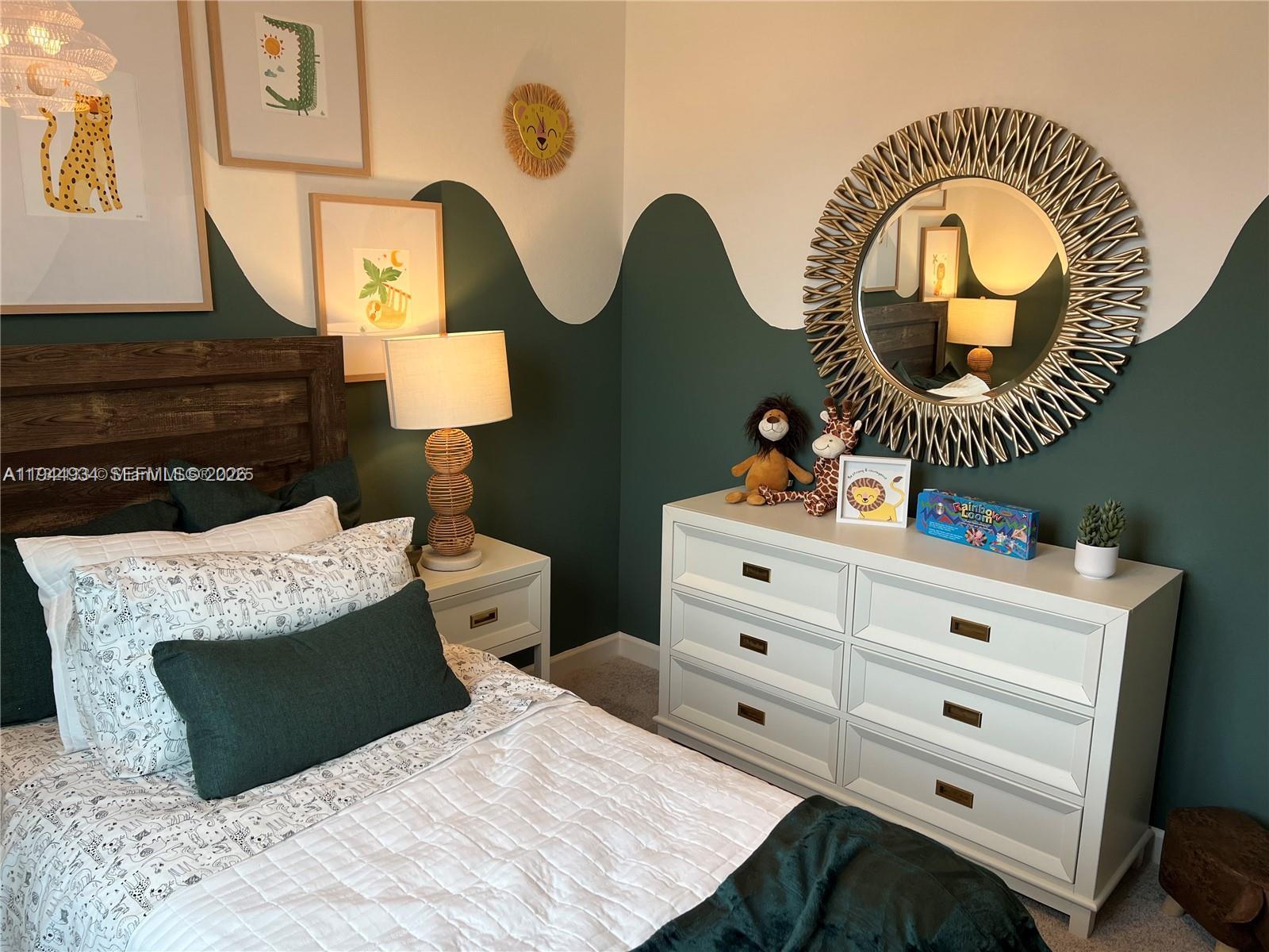 655 Southeast 13th Street Homestead, FL 33034 - Photo 24 of 38 a bedroom with a bed and a mirror on the dresser