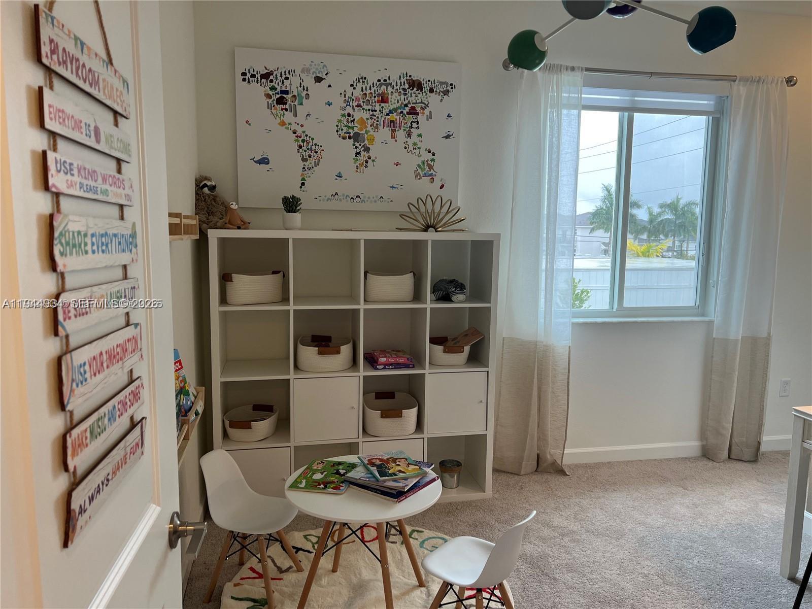 655 Southeast 13th Street Homestead, FL 33034 - Photo 26 of 38 a view of a dining room with furniture and a window