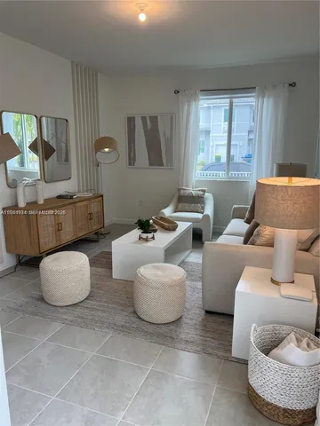 a living room with furniture and a table