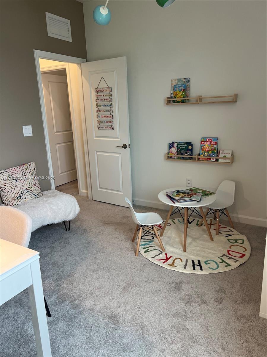 655 Southeast 13th Street Homestead, FL 33034 - Photo 29 of 38 a living room with furniture and a table
