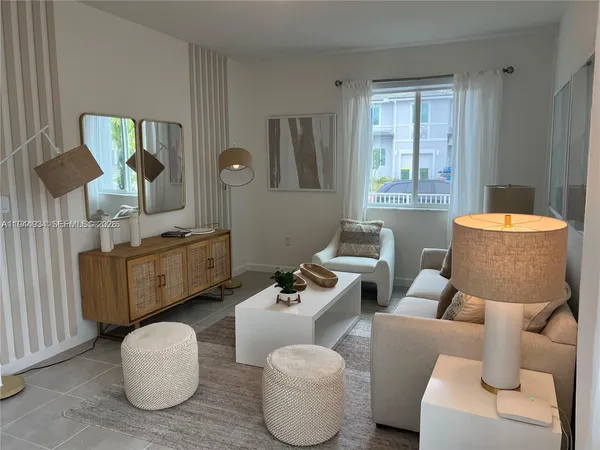 a living room with furniture and a window