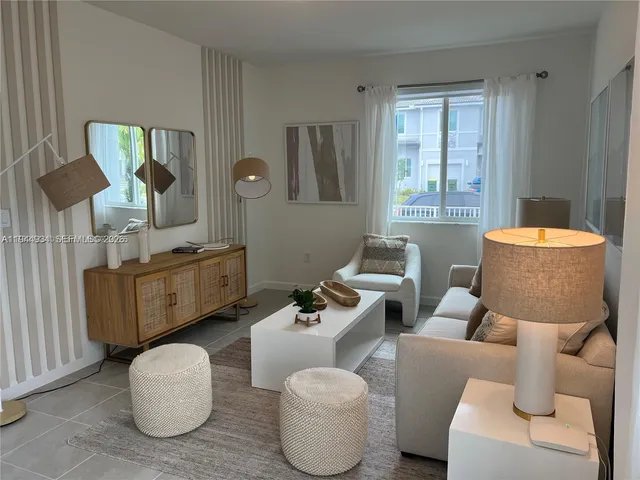 a living room with furniture and a window