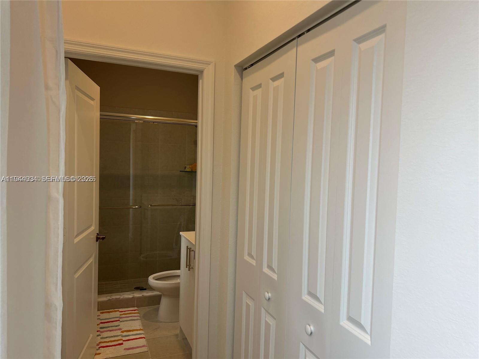 655 Southeast 13th Street Homestead, FL 33034 - Photo 33 of 38 a bathroom with a shower and a toilet