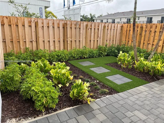 a view of a garden with a chair