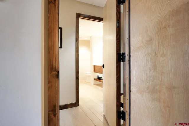a view of a bathroom from a hallway