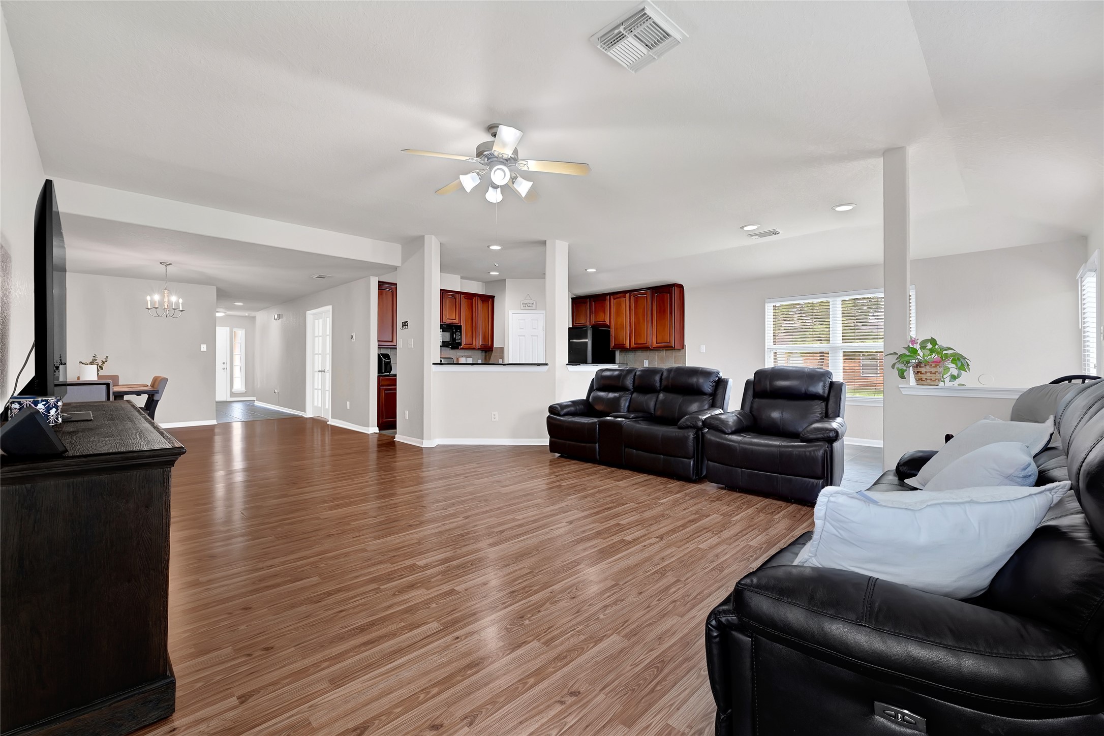 3114 Rendezvous Court Spring, TX 77373 - Photo 11 of 24 a living room with furniture and a wooden floor