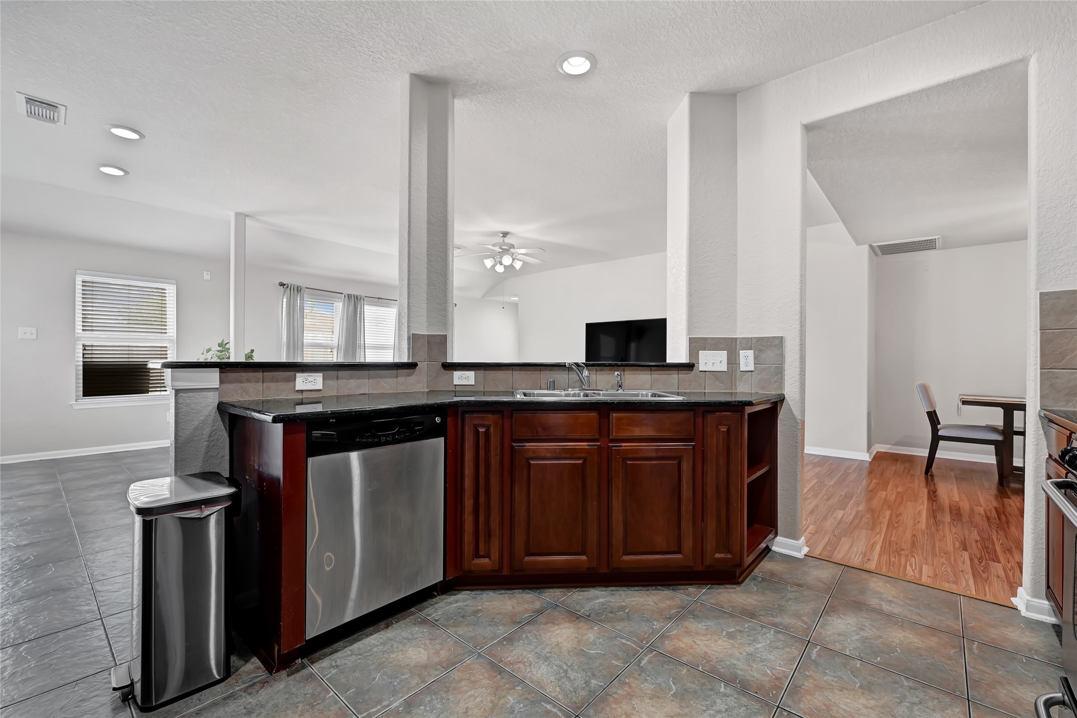 3114 Rendezvous Court Spring, TX 77373 - Photo 13 of 24 a kitchen with stainless steel appliances granite countertop a sink and a stove