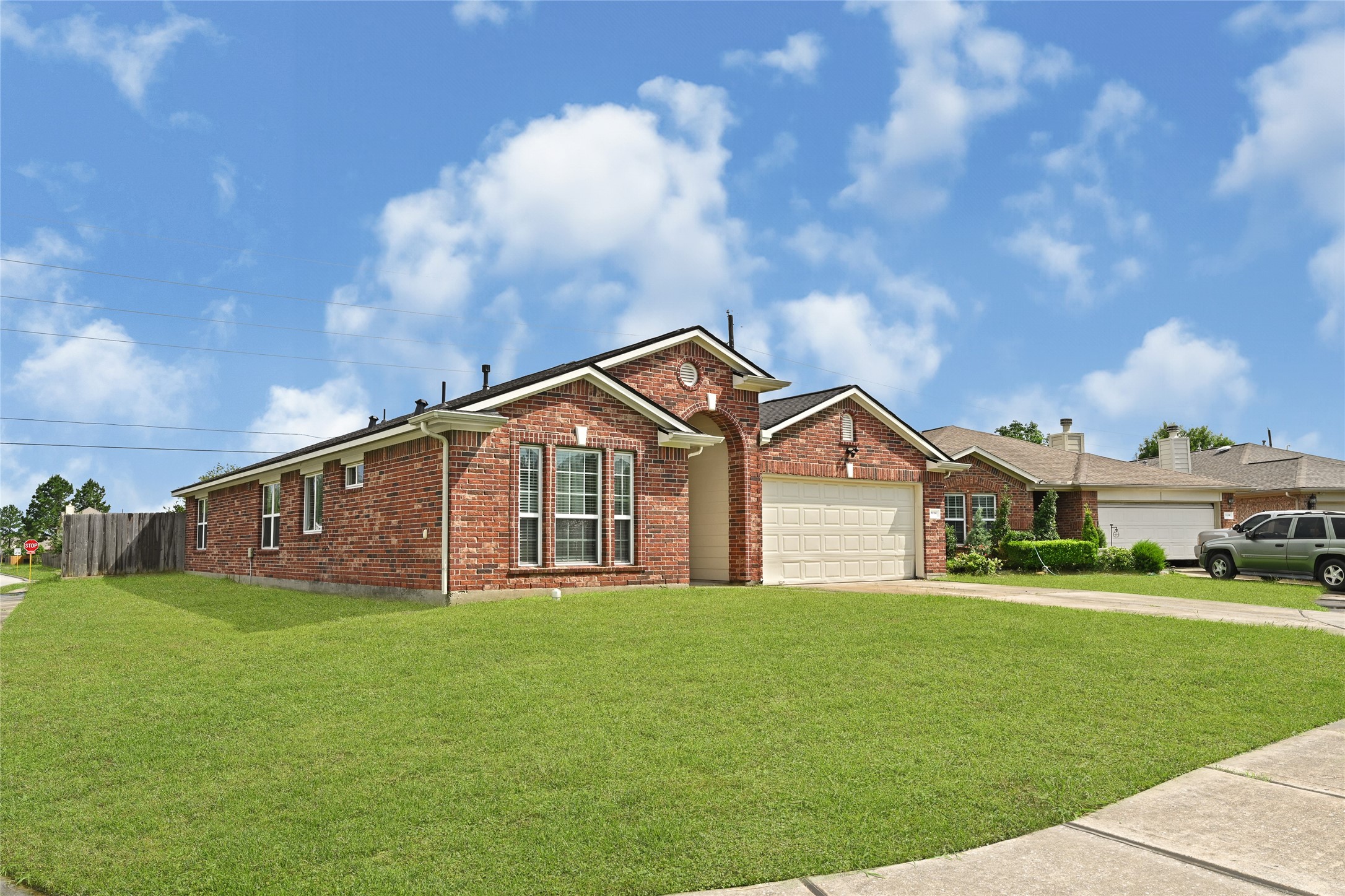 3114 Rendezvous Court Spring, TX 77373 - Photo 2 of 24 a front view of a house with a yard and trees