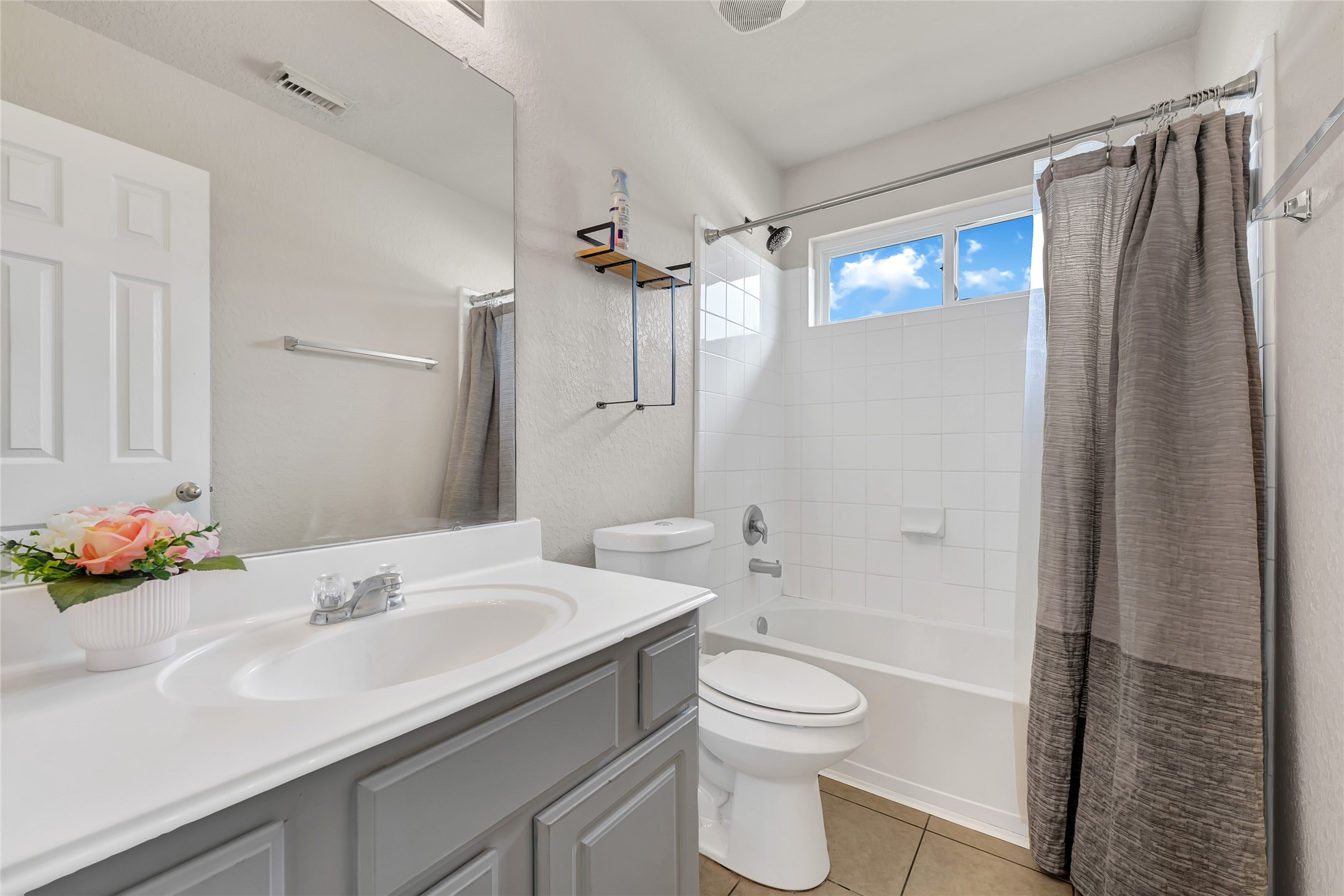 3114 Rendezvous Court Spring, TX 77373 - Photo 8 of 24 a bathroom with a sink a toilet and shower