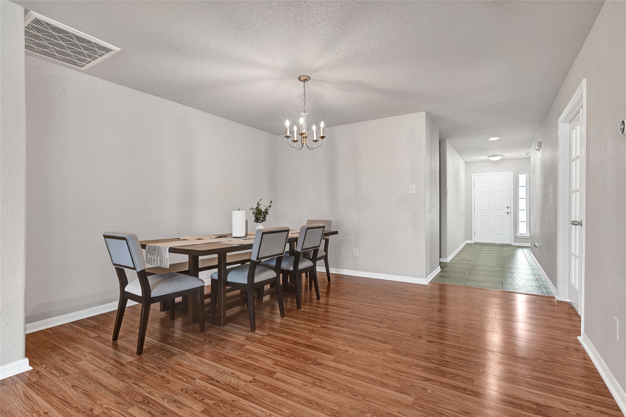 3114 Rendezvous Court Spring, TX 77373 - Photo 9 of 24 a view of a dining room with furniture and wooden floor