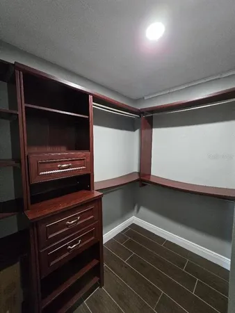 a kitchen with wooden cabinets and a stove top oven