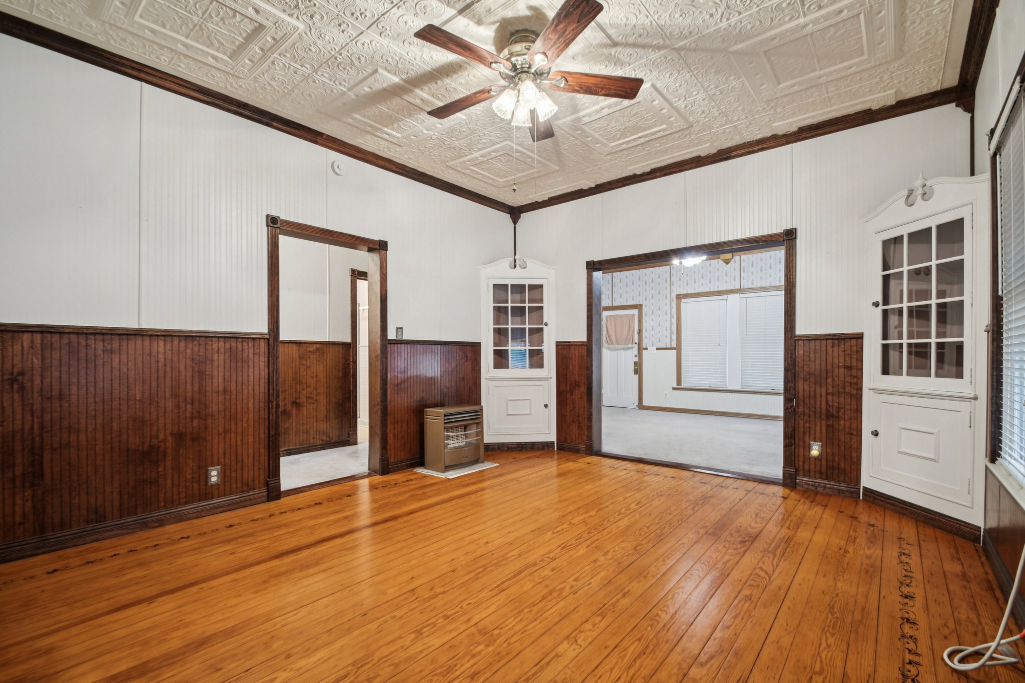 611 North Main Street Elgin, TX 78621 - Photo 13 of 26 a view of a livingroom with an empty space and kitchen space