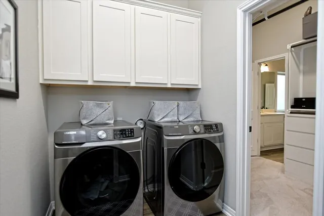 a kitchen with a refrigerator and cabinets