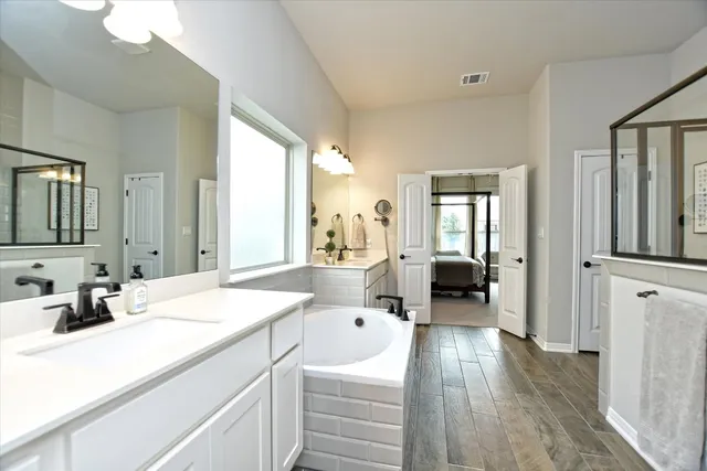 a living room with furniture a couch and a flat screen tv