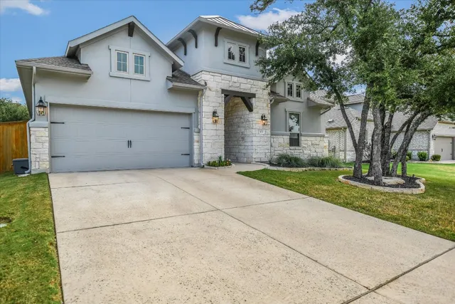 a living room with furniture a window and a fireplace