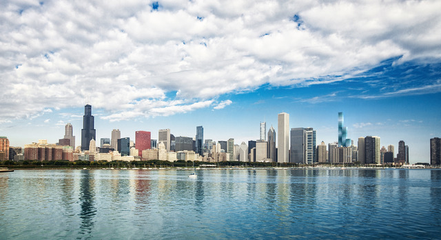 363 East Wacker Drive, Unit 3205 Chicago, IL 60601 - Photo 5 of 20 a view of a ocean with boats and trees in the background