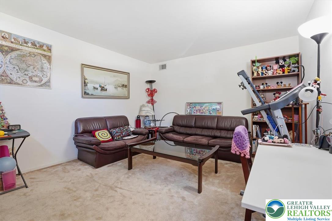 808 Hunter Road Easton, PA 18040 - Photo 7 of 41 An inviting office/den area with a plush carpet floor and high ceilings awaits.