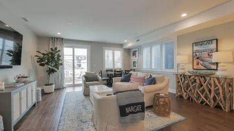 a living room with furniture or couch and a wooden floor