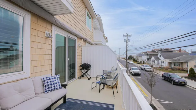 a view of a patio with couches and potted plants