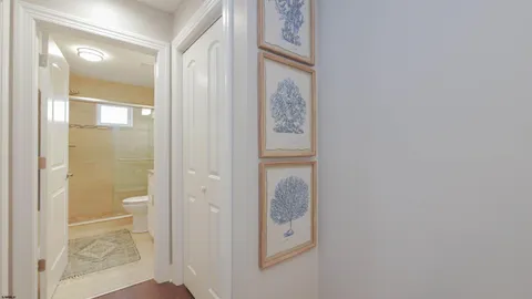 a bathroom with a glass shower door and a glass door