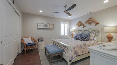 a bedroom with a bed and a chair