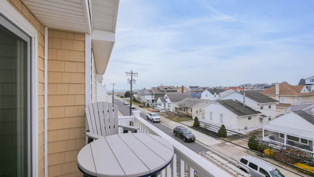 a view of a balcony with chairs