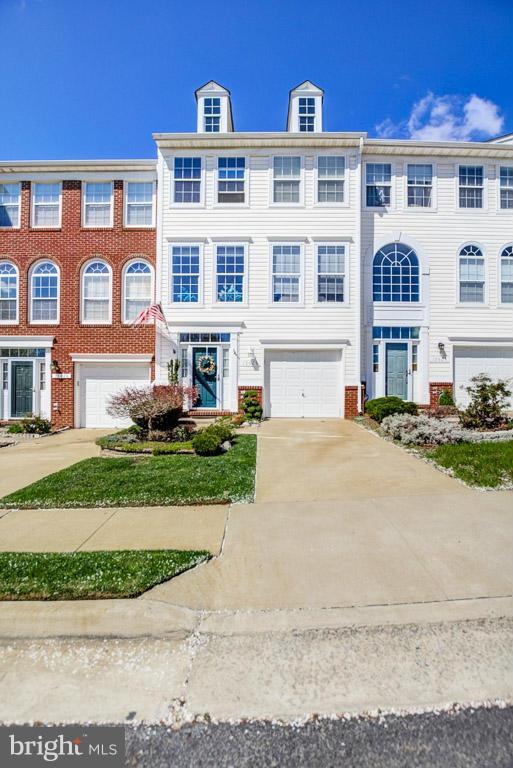 15626 Avocet Loop Woodbridge, VA 22191 - Photo 1 of 30 a front view of residential houses with yard