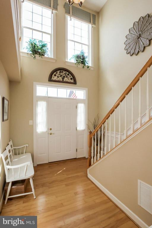 15626 Avocet Loop Woodbridge, VA 22191 - Photo 2 of 30 a view of a livingroom with wooden floor and windows