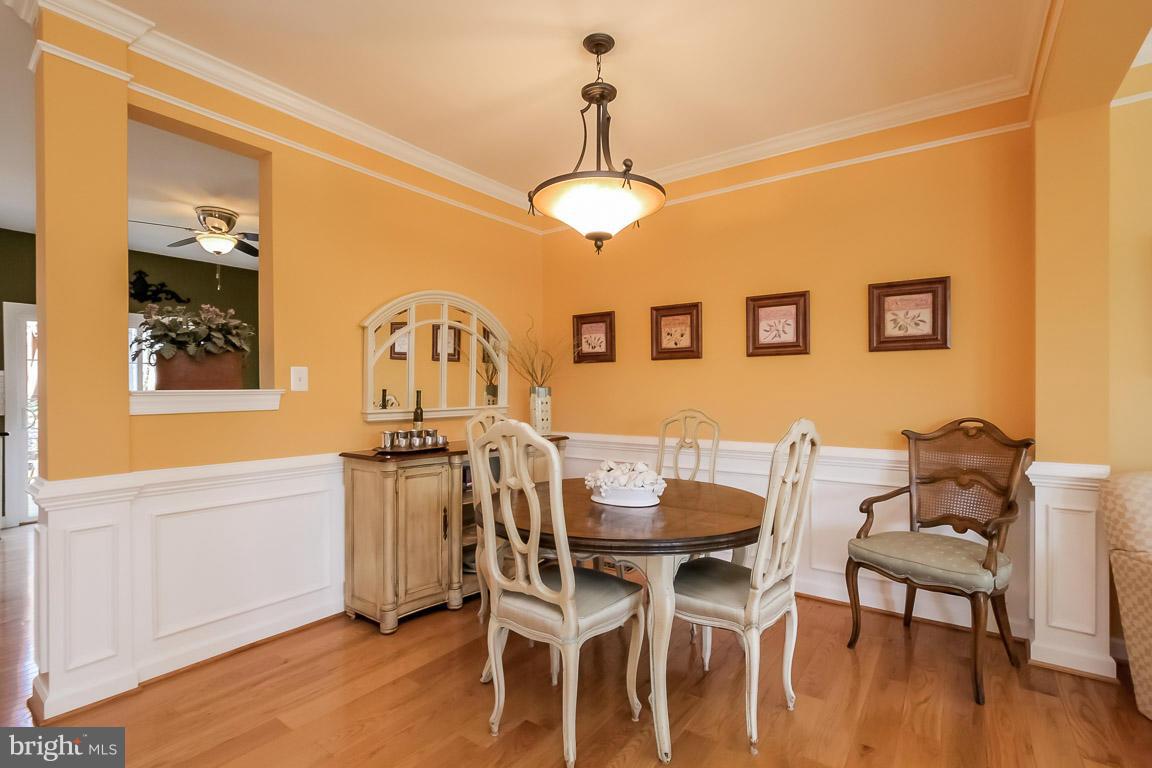15626 Avocet Loop Woodbridge, VA 22191 - Photo 15 of 30 a view of a dining room with furniture and wooden floor