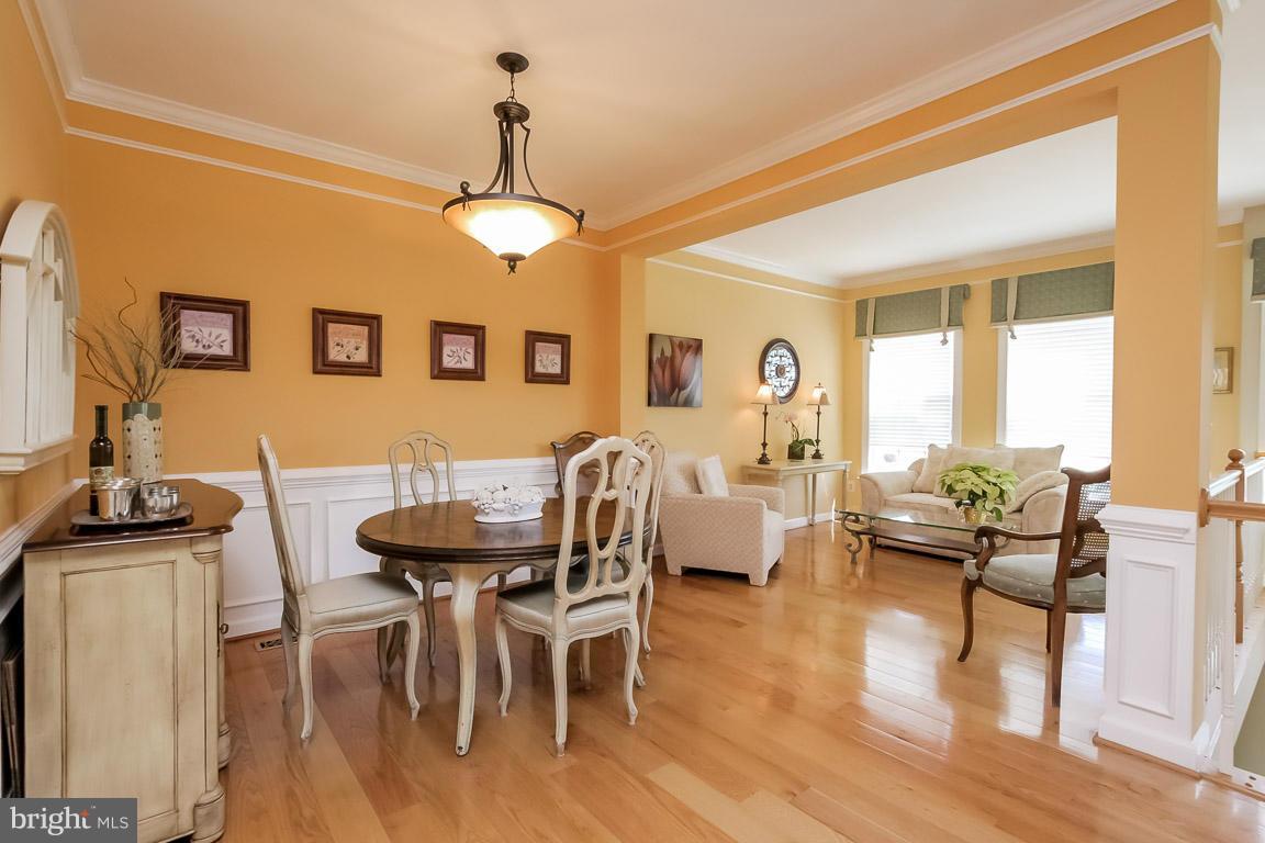 15626 Avocet Loop Woodbridge, VA 22191 - Photo 16 of 30 a view of a dining room with furniture window and wooden floor