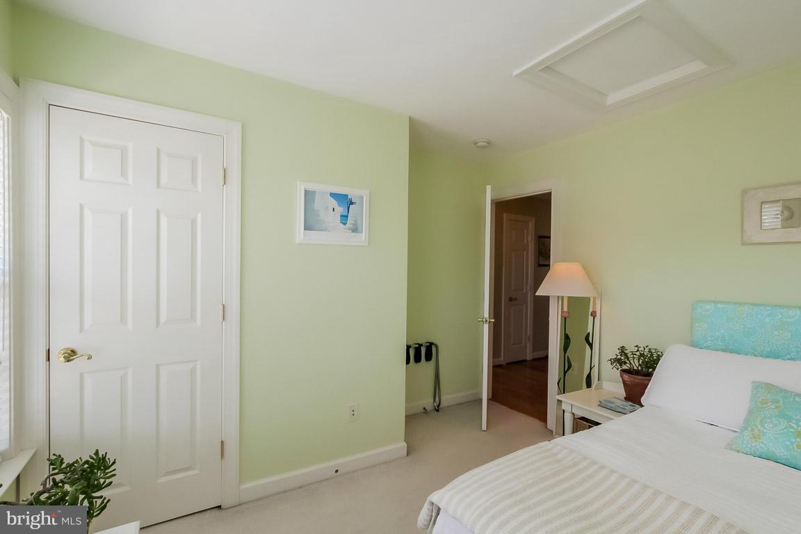 15626 Avocet Loop Woodbridge, VA 22191 - Photo 20 of 30 a bedroom with a bed and a table