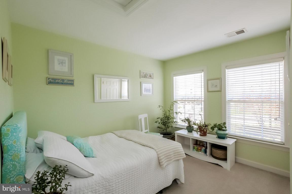 15626 Avocet Loop Woodbridge, VA 22191 - Photo 21 of 30 a bedroom with a bed and a window